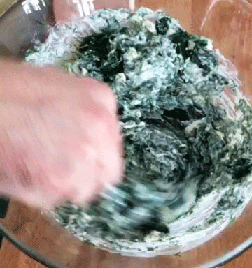 mixing feta and spinach