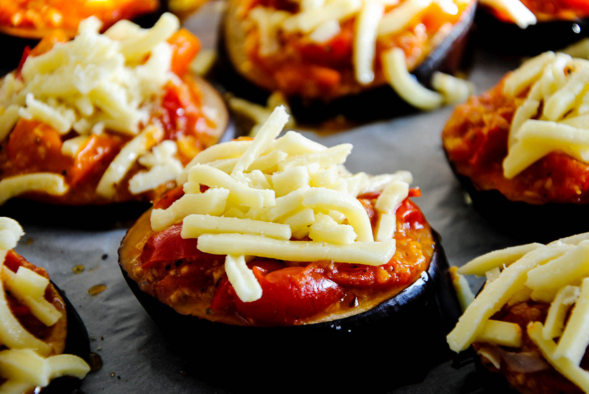 eggplant pizza with cheese on top