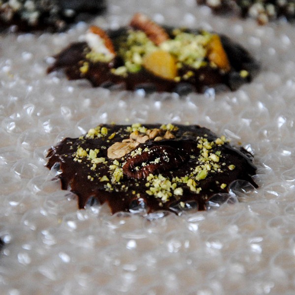 dark chocolate bites on bubble wrap