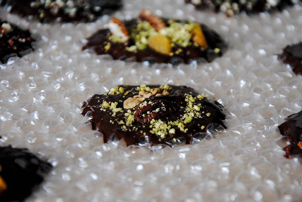 dark chocolate bites on bubble wrap