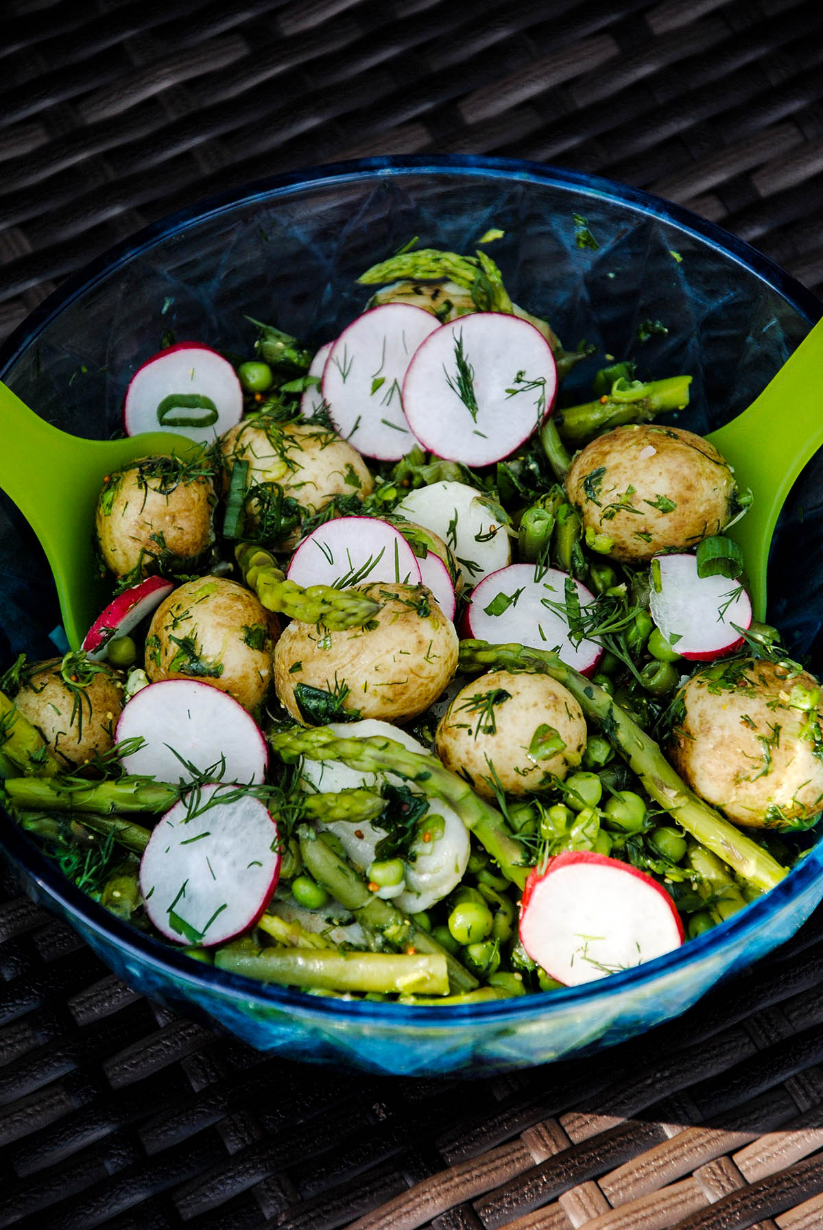 Potato salad with radish, asparagus, dill and other greens