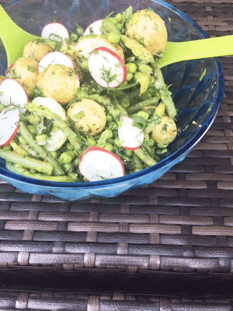 Potato salad with green spoon